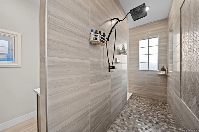 a bathroom with a glass door shower