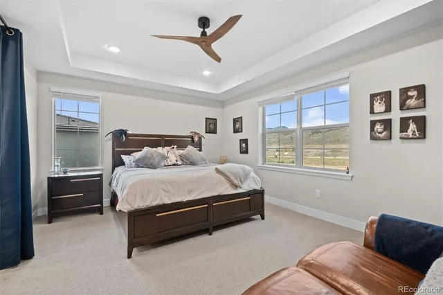 a bedroom with a bed couch and window
