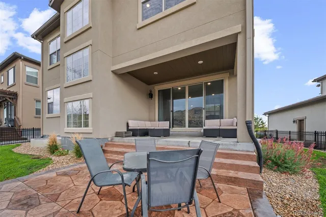 a outdoor space with a large window and furniture
