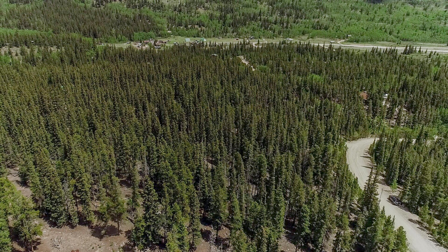 503 Golden Hills Road Fairplay, CO 80440 - Photo 28 of 36 Aerial view of property and surrounding area featuring a forest