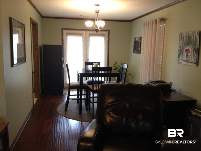 111 Woodside Drive Daphne, AL 36526 - Photo 4 of 31 The formal dining room has a great view of the vast backyard with privacy fencing