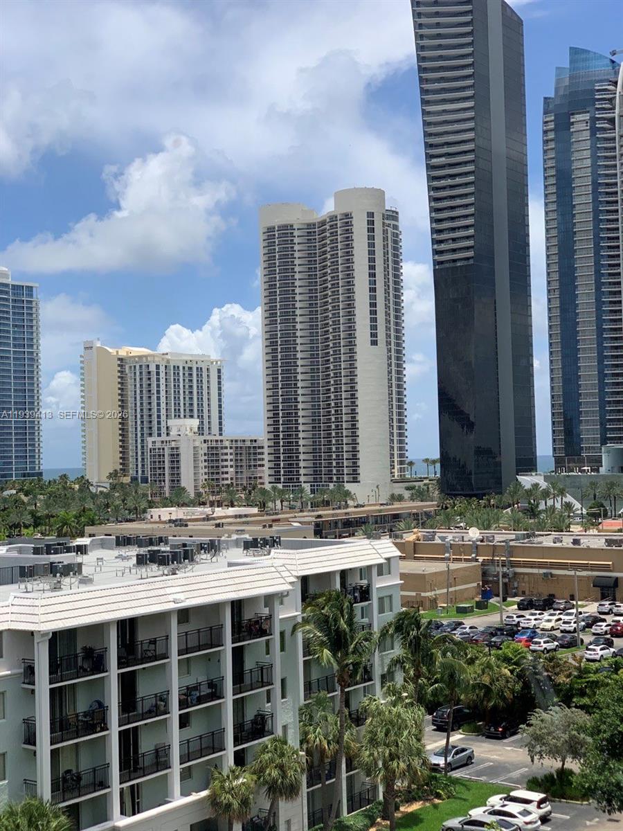 17021 North Bay Road, Unit 907 Sunny Isles Beach, FL 33160 - Photo 18 of 19 a view of building with yard and sitting space