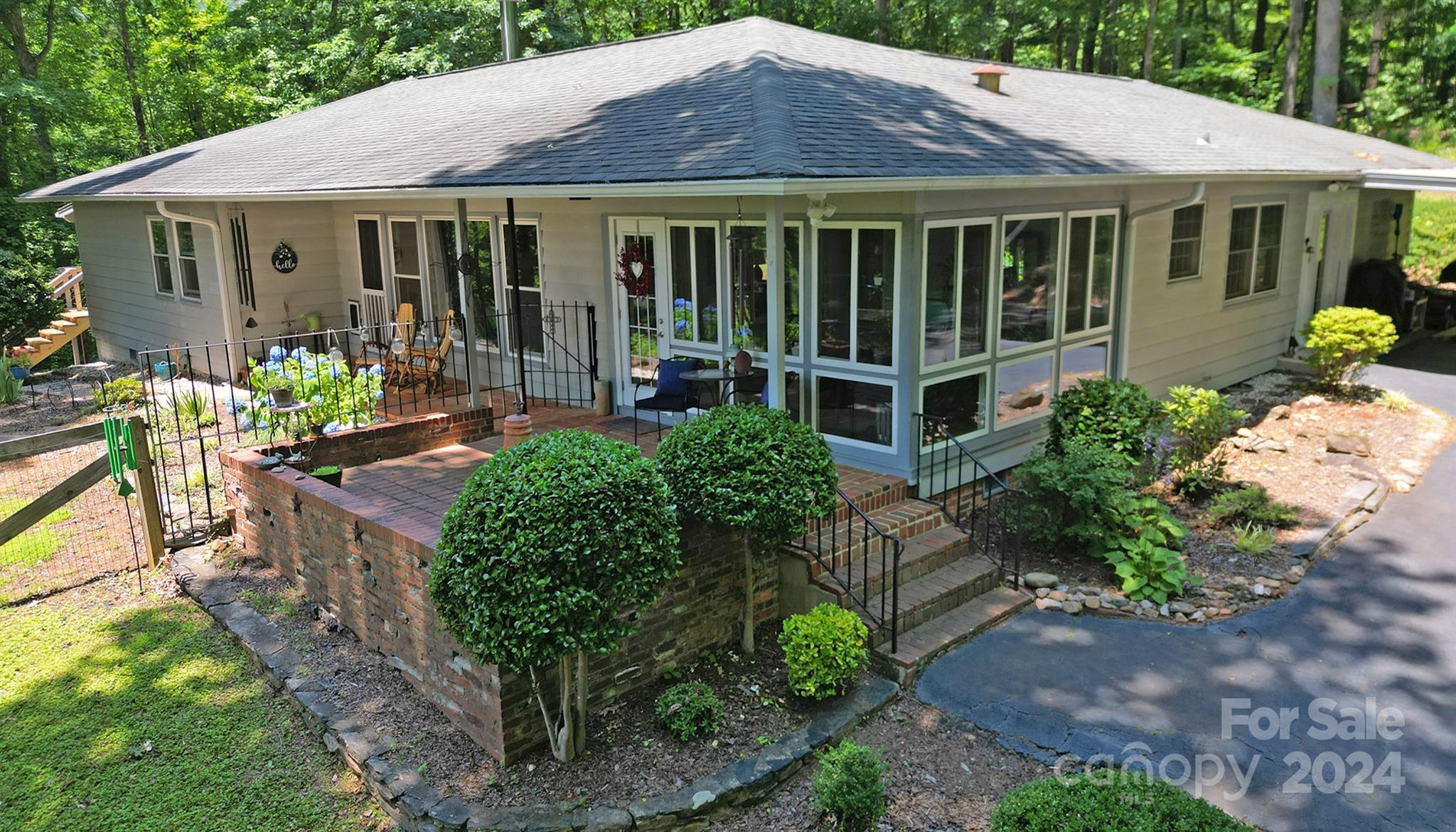 376 Page Farm Road Tryon, NC 28782 - Photo 1 of 34 a front view of a house with garden