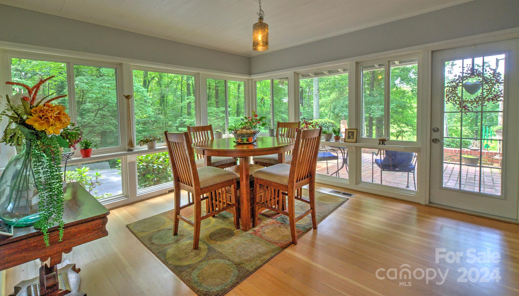376 Page Farm Road Tryon, NC 28782 - Photo 11 of 34 a view of a dining room with furniture window and wooden floor