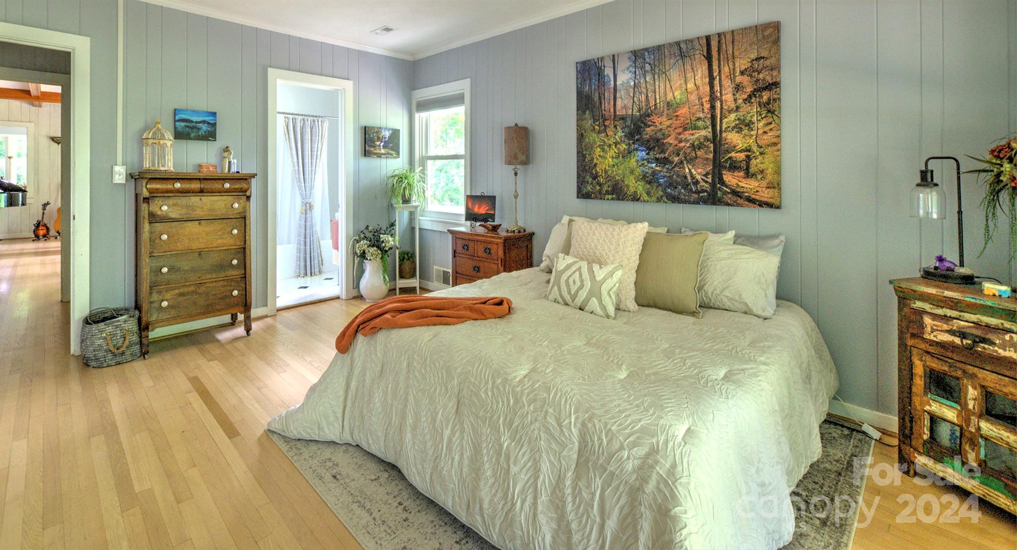 376 Page Farm Road Tryon, NC 28782 - Photo 13 of 34 a bedroom with a bed and a painting on the wall