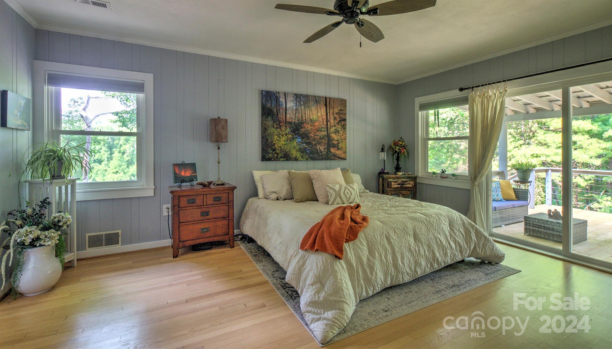 376 Page Farm Road Tryon, NC 28782 - Photo 14 of 34 a bedroom with a bed and large windows