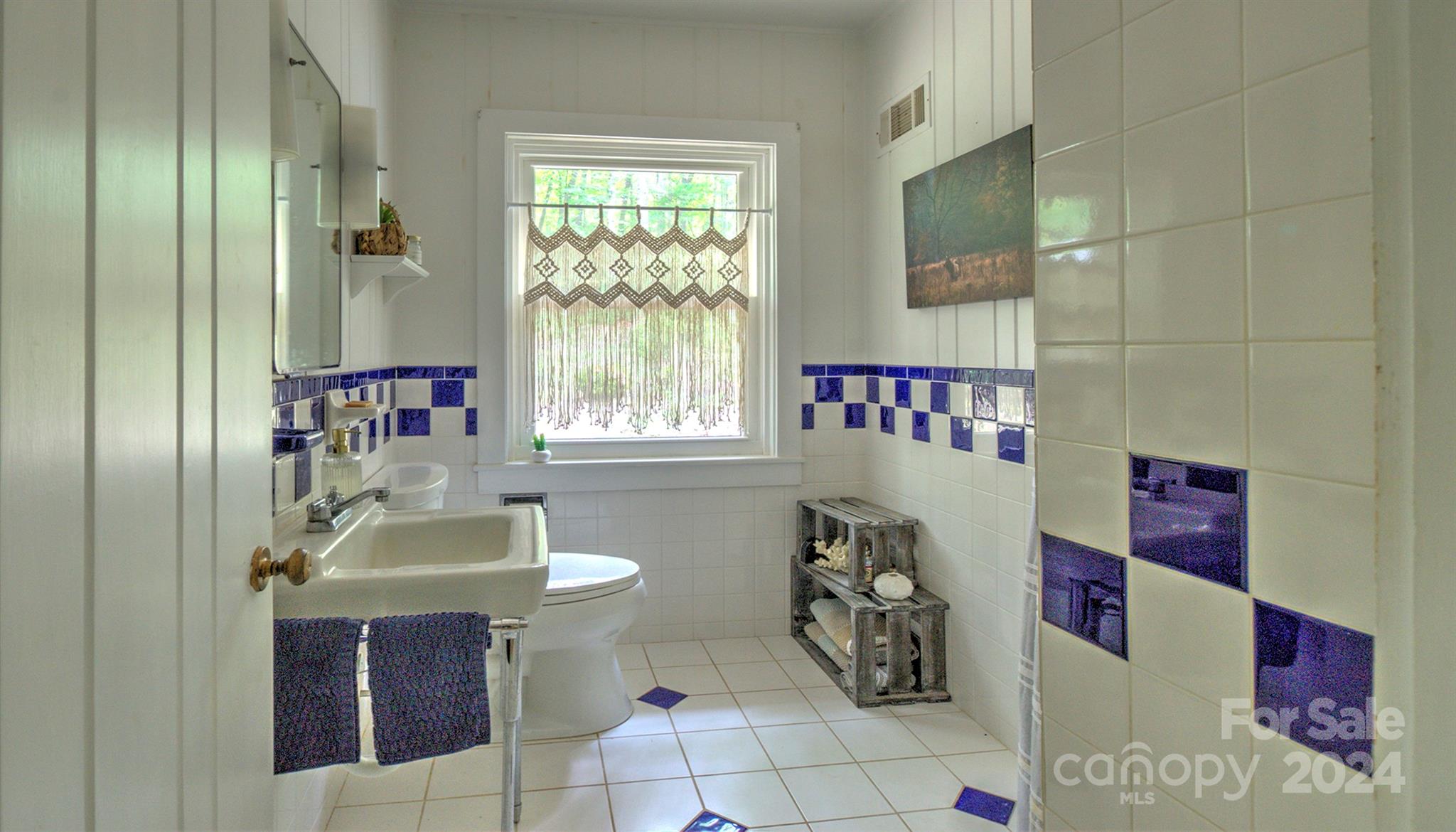 376 Page Farm Road Tryon, NC 28782 - Photo 17 of 34 a bathroom with a sink and a mirror