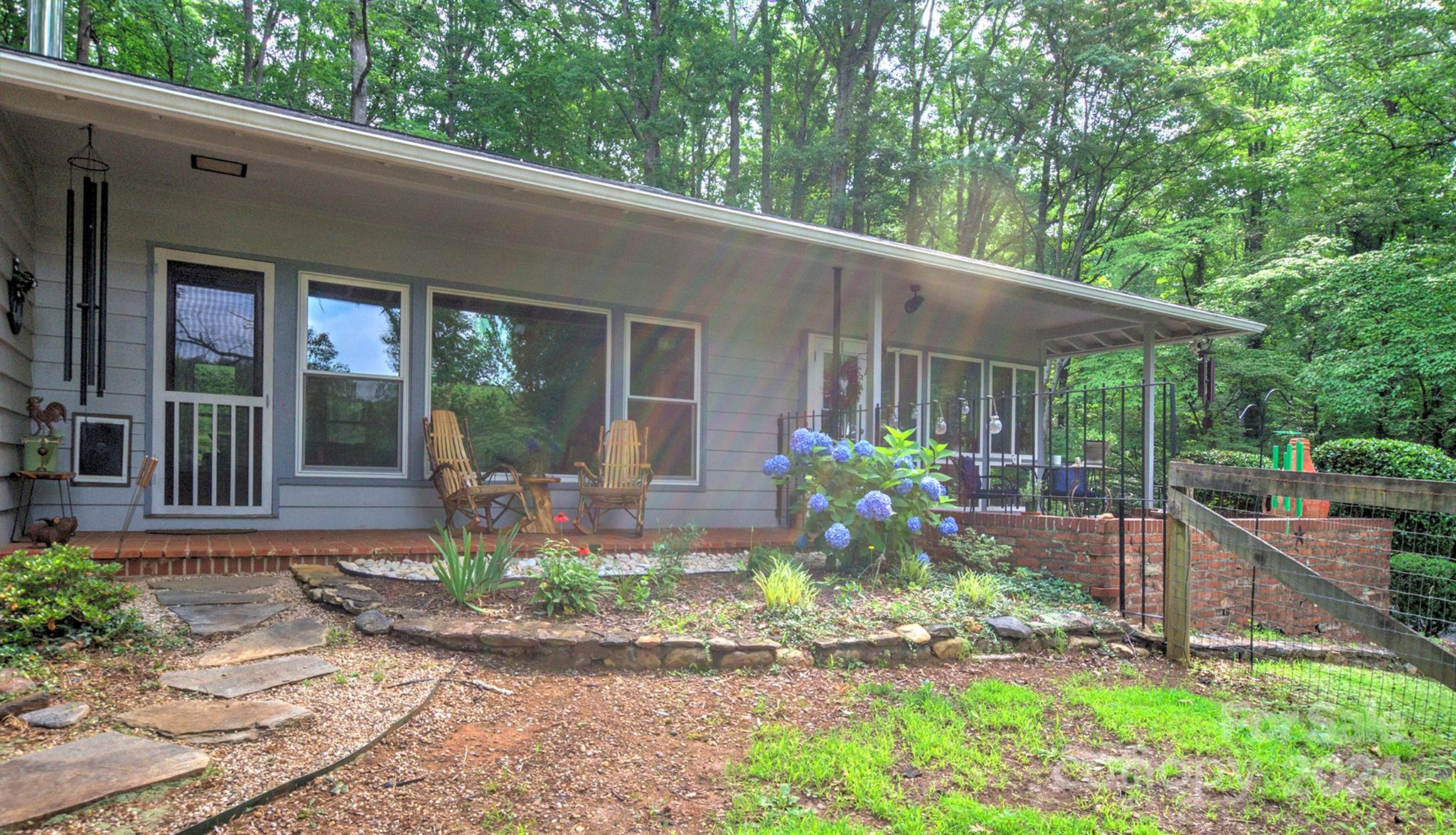 376 Page Farm Road Tryon, NC 28782 - Photo 2 of 34 a front view of a house with garden