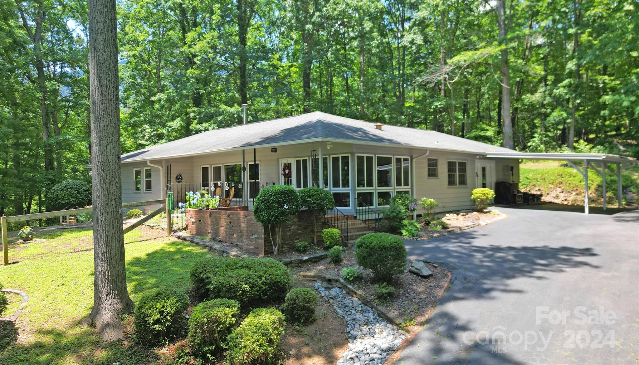 376 Page Farm Road Tryon, NC 28782 - Photo 27 of 34 a front view of a house with garden