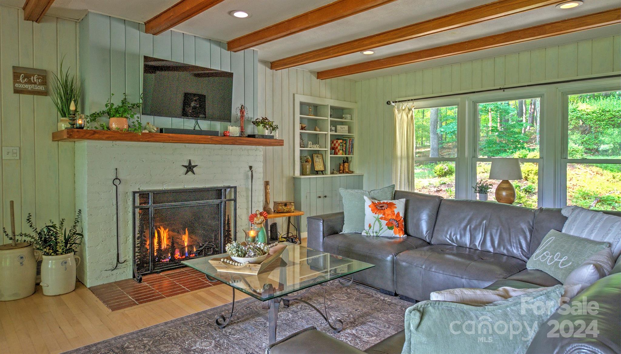 376 Page Farm Road Tryon, NC 28782 - Photo 4 of 34 a living room with furniture and a fireplace