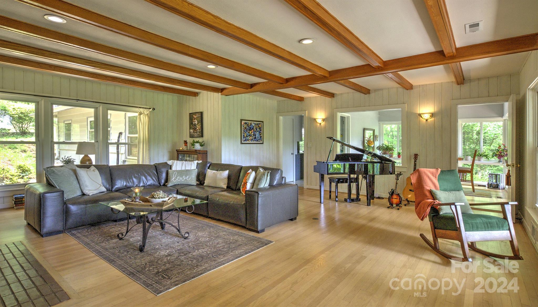 376 Page Farm Road Tryon, NC 28782 - Photo 5 of 34 a living room with furniture and a potted plant