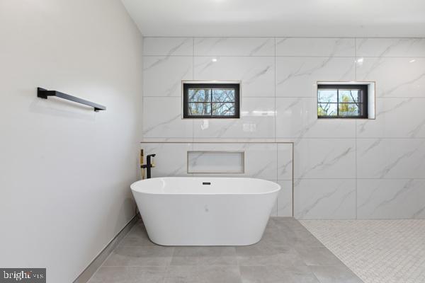 11701 Duckettown Road Bowie, MD 20720 - Photo 11 of 27 a view of a bathtub in a bathroom