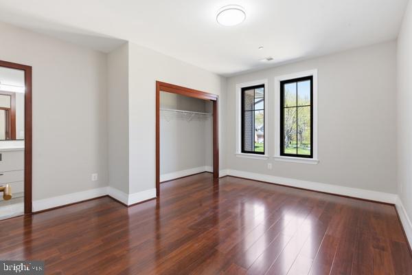 11701 Duckettown Road Bowie, MD 20720 - Photo 13 of 27 an empty room with wooden floor and windows