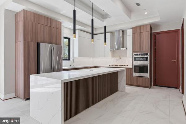 11701 Duckettown Road Bowie, MD 20720 - Photo 14 of 27 a kitchen with stainless steel appliances a refrigerator and a stove top oven