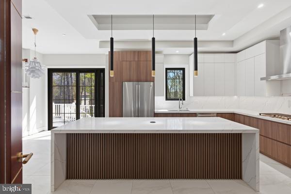 11701 Duckettown Road Bowie, MD 20720 - Photo 15 of 27 a kitchen with a wooden floor and a large window