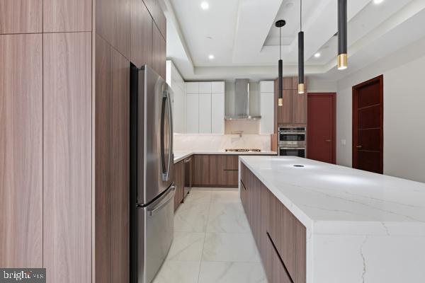 11701 Duckettown Road Bowie, MD 20720 - Photo 16 of 27 a kitchen with stainless steel appliances a refrigerator and a sink