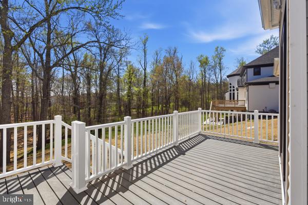 11701 Duckettown Road Bowie, MD 20720 - Photo 17 of 27 a view of a wooden deck with a trees