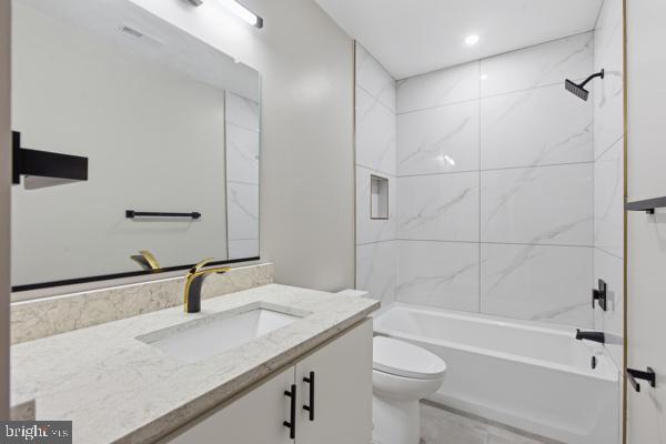 11701 Duckettown Road Bowie, MD 20720 - Photo 21 of 27 a bathroom with a granite countertop sink toilet and shower