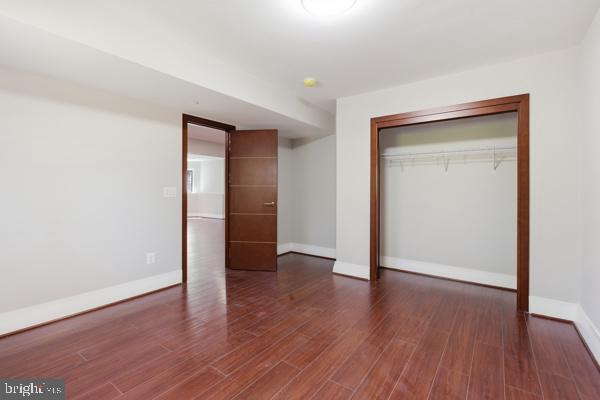 11701 Duckettown Road Bowie, MD 20720 - Photo 22 of 27 an empty room with wooden floor & closet