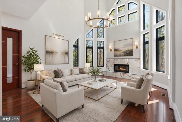 11701 Duckettown Road Bowie, MD 20720 - Photo 3 of 27 a living room with furniture a table and a fireplace