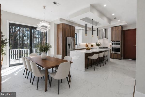 11701 Duckettown Road Bowie, MD 20720 - Photo 4 of 27 a view of a dining room with furniture window and outside view