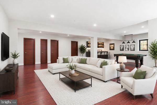 11701 Duckettown Road Bowie, MD 20720 - Photo 6 of 27 a living room with furniture fireplace and a flat screen tv