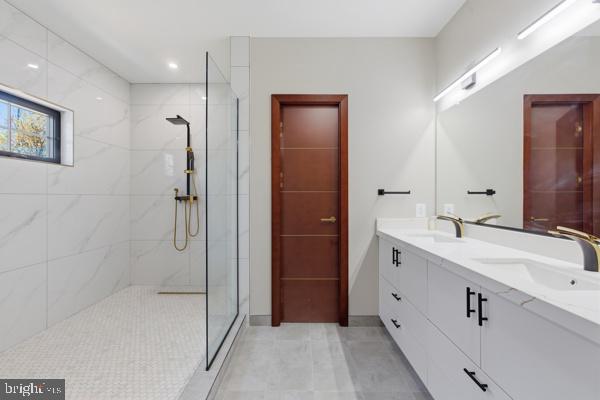 11701 Duckettown Road Bowie, MD 20720 - Photo 8 of 27 a bathroom with a double vanity sink and mirror