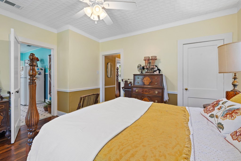 807 Cecelia Street Taylor, TX 76574 - Photo 15 of 24 a bedroom with a bed and a dresser in it