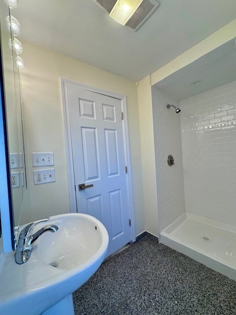56 Cummings Road, Unit B Boston, MA 02135 - Photo 10 of 13 a bathroom with a tub and shower