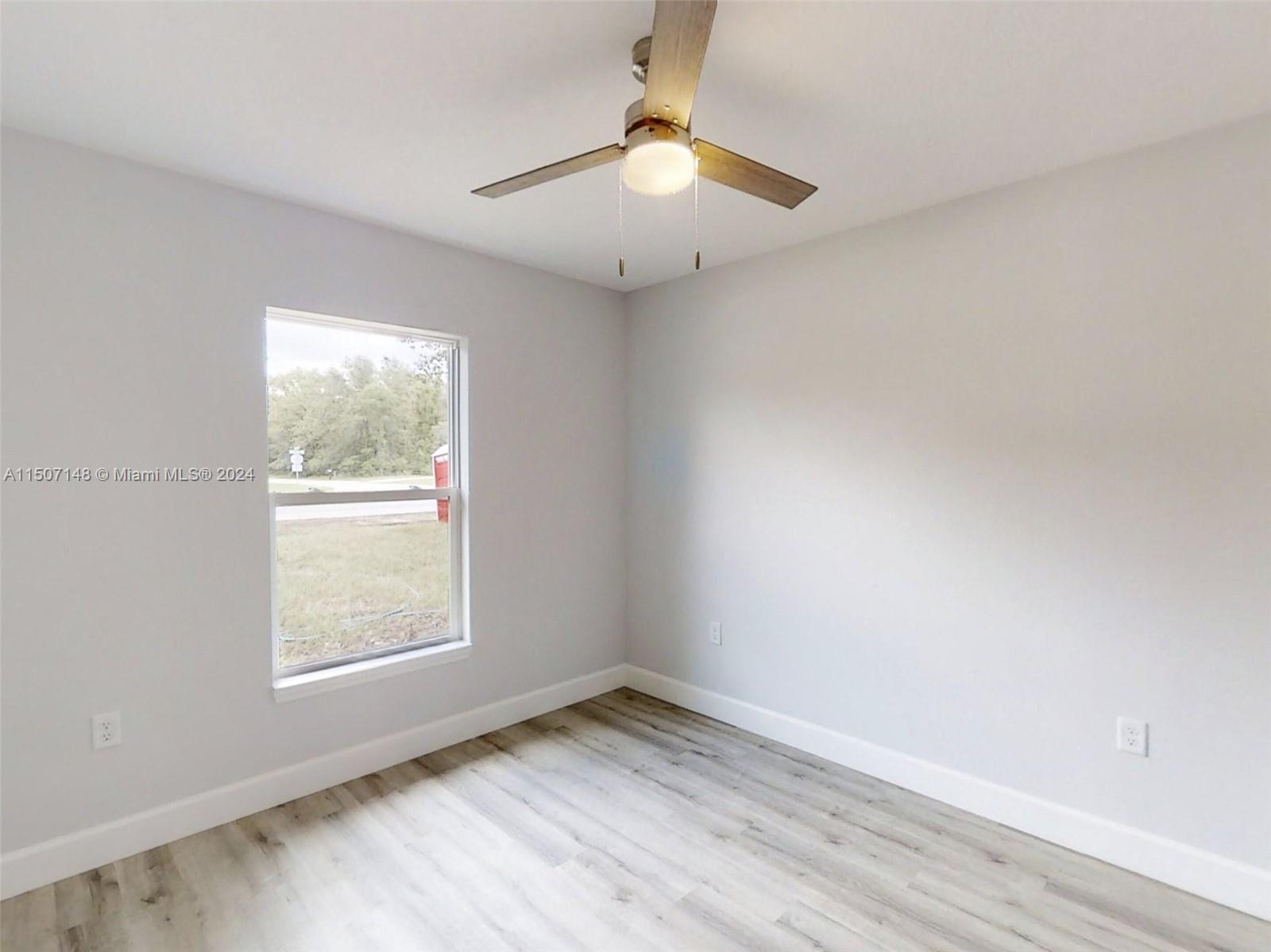 14512 Southwest 25th Lane Ocala, FL 34481 - Photo 14 of 30 an empty room with a window