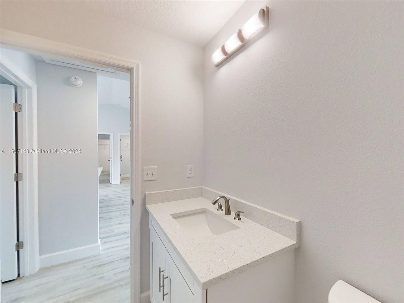 14512 Southwest 25th Lane Ocala, FL 34481 - Photo 17 of 30 a bathroom with a sink a toilet and shower