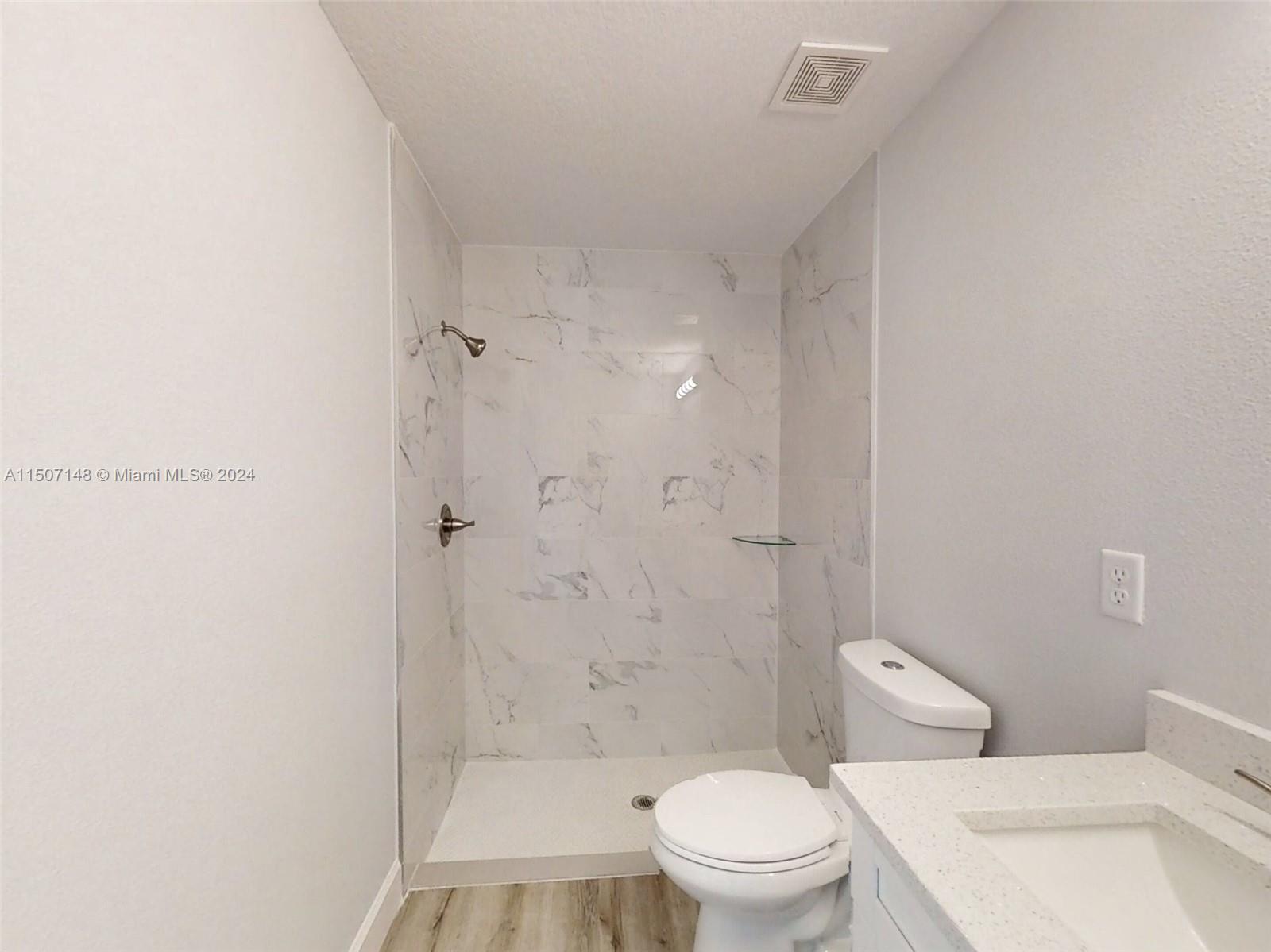14512 Southwest 25th Lane Ocala, FL 34481 - Photo 25 of 30 a bathroom with a toilet and a shower
