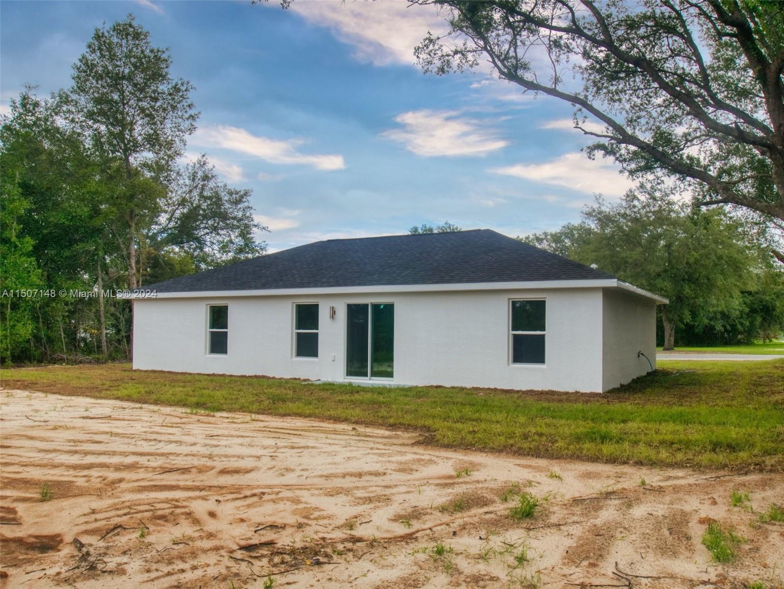 14512 Southwest 25th Lane Ocala, FL 34481 - Photo 29 of 30 a view of a house with a yard