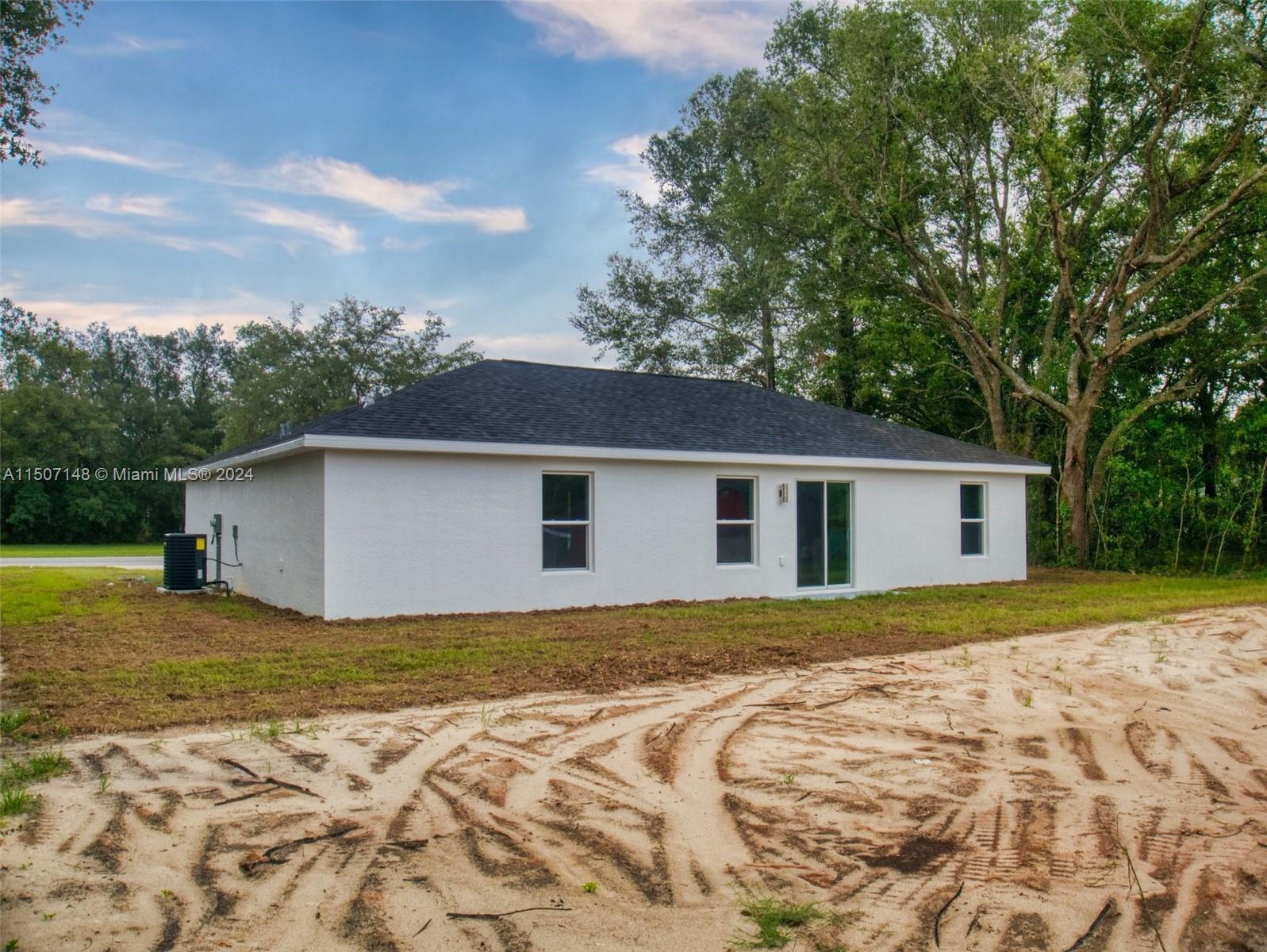 14512 Southwest 25th Lane Ocala, FL 34481 - Photo 30 of 30 a house with trees in the background