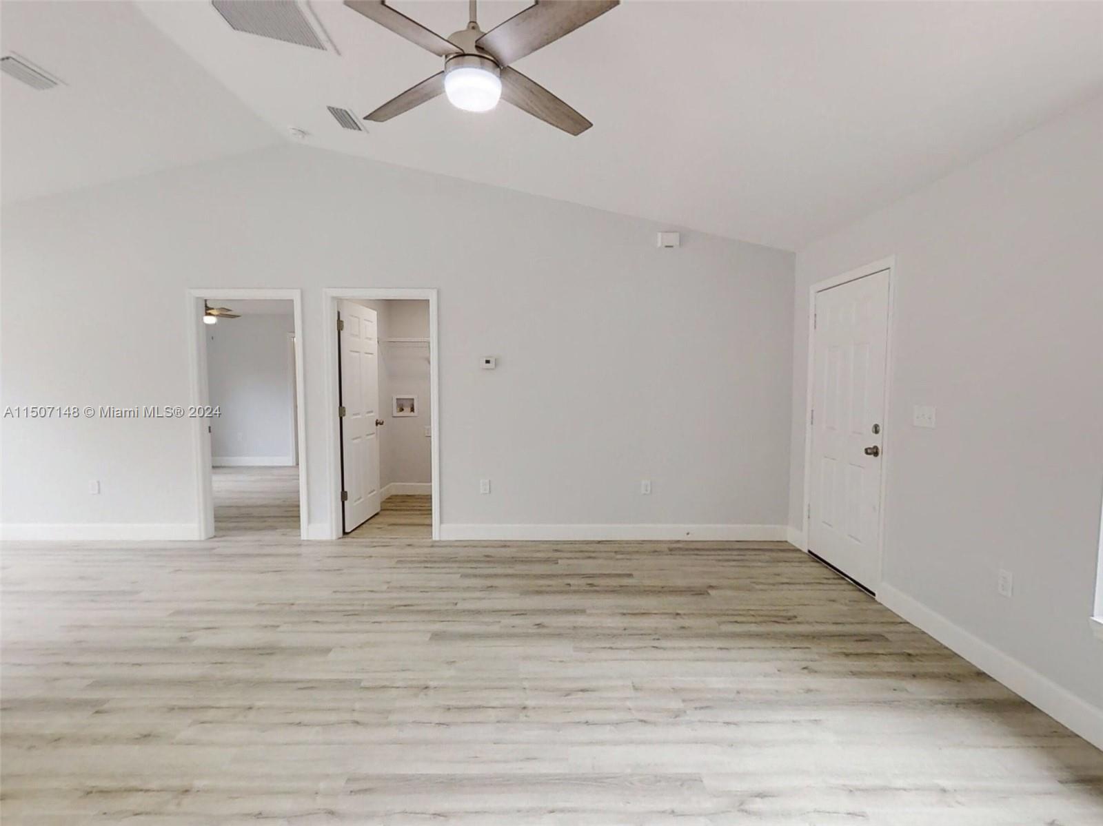 14512 Southwest 25th Lane Ocala, FL 34481 - Photo 7 of 30 a view of an empty room with a ceiling fan