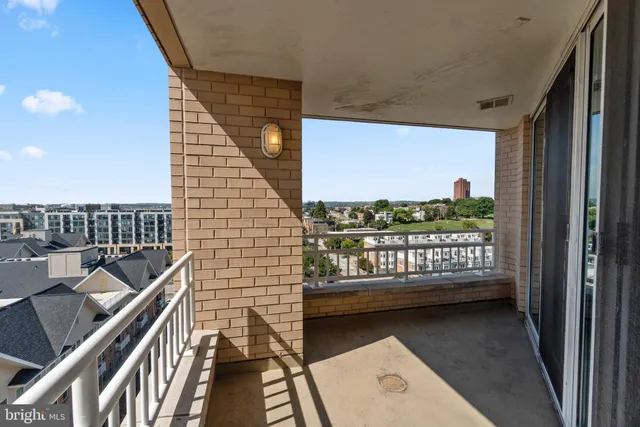 a view of a balcony with a city view