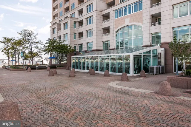 a view of a brick building next to a yard