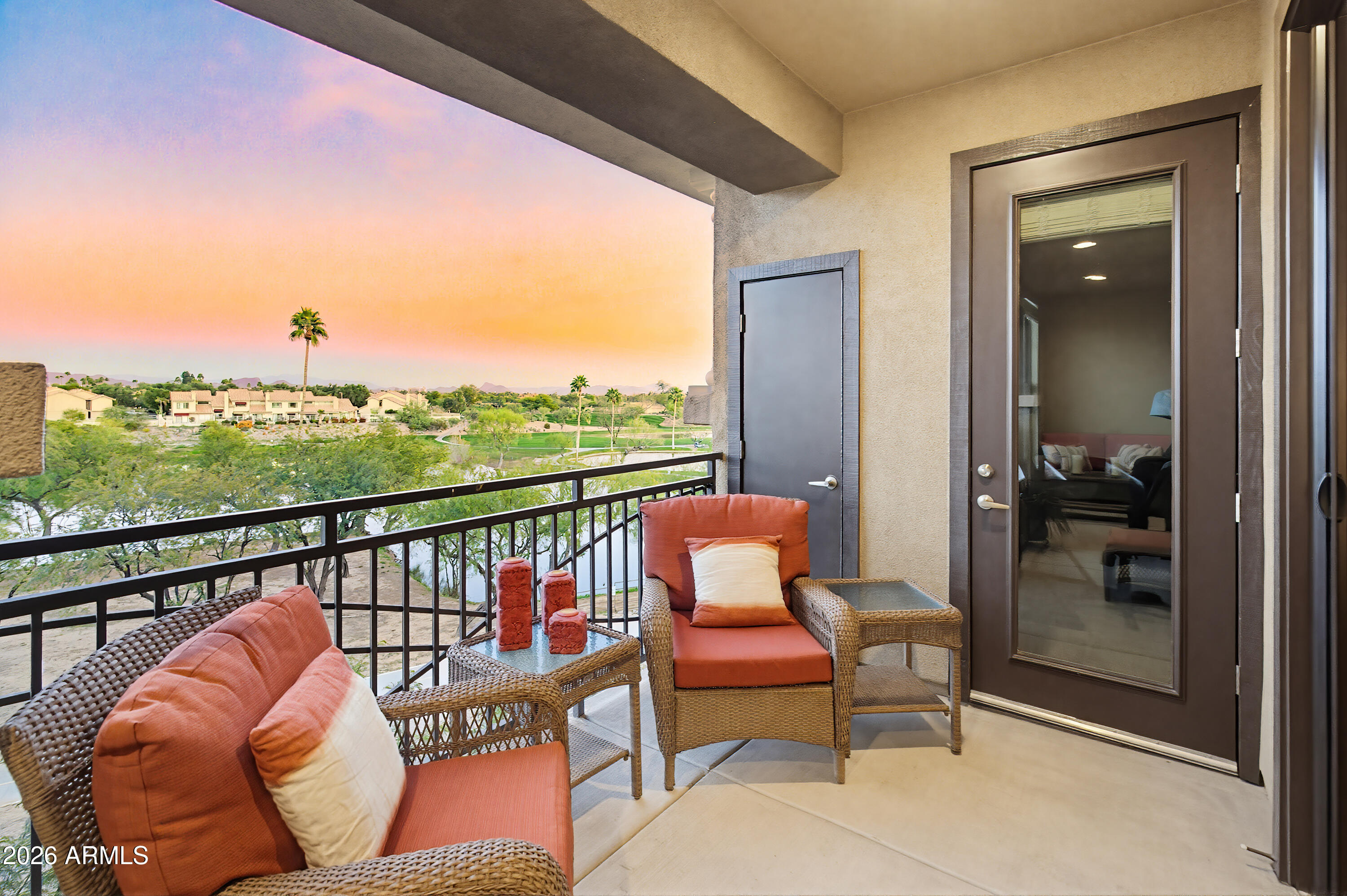 7601 East Indian Bend Road, Unit 3045 Scottsdale, AZ 85250 - Photo 21 of 32 a balcony with an outdoor seating
