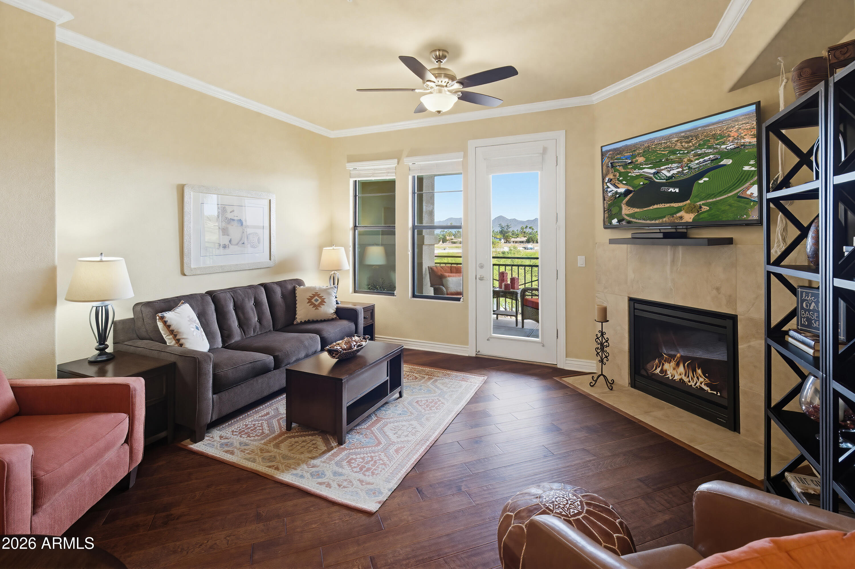 7601 East Indian Bend Road, Unit 3045 Scottsdale, AZ 85250 - Photo 3 of 32 a living room with furniture and a fireplace