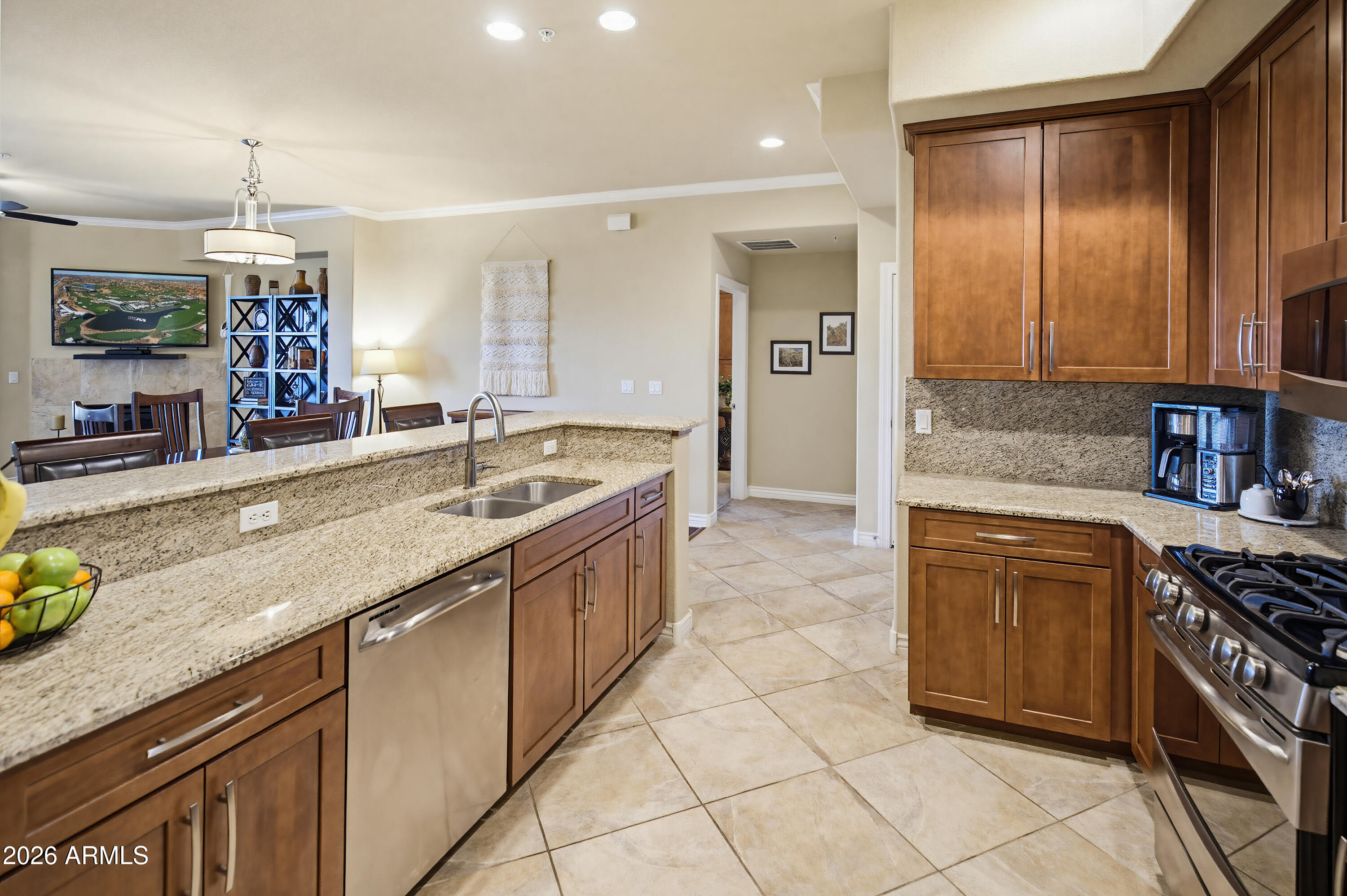7601 East Indian Bend Road, Unit 3045 Scottsdale, AZ 85250 - Photo 5 of 32 a kitchen with stainless steel appliances granite countertop a sink and cabinets