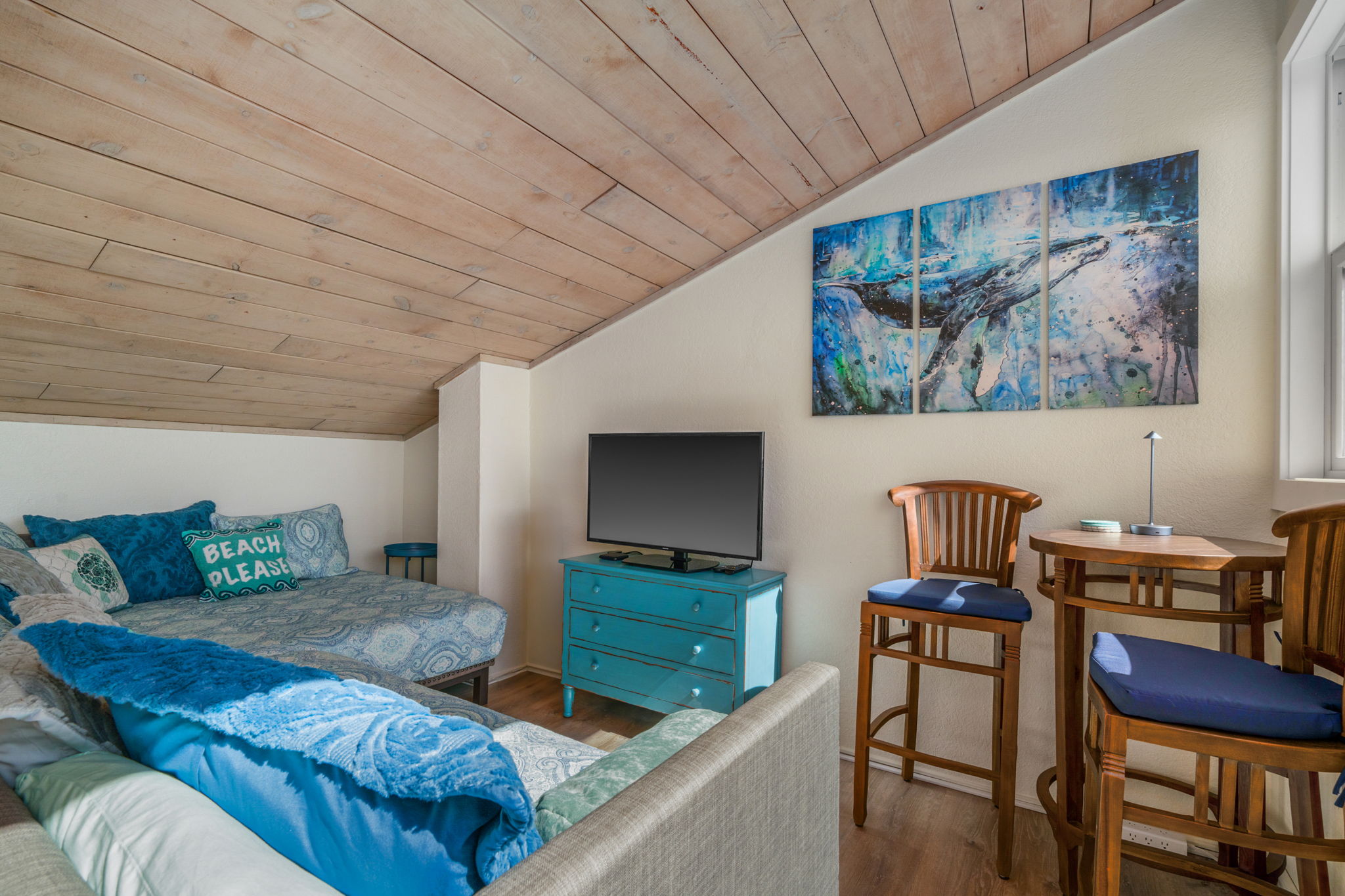 1661 Pee Road, Unit I302 Koloa, HI 96756 - Photo 22 of 30 a living room with furniture and a flat screen tv