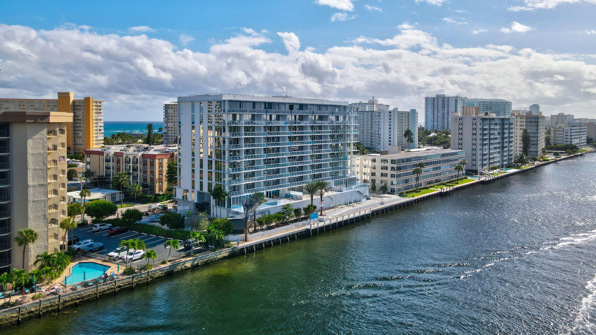 407 North Riverside Drive, Unit 205 Pompano Beach, FL 33062 - Photo 5 of 12 a view of a lake with a large building