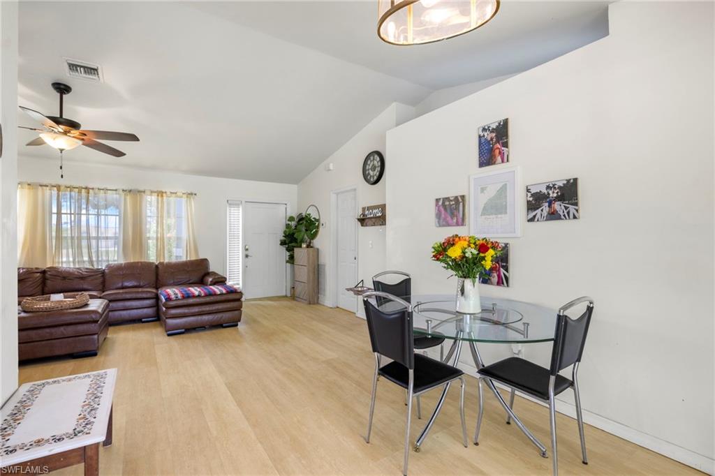 8366 Cardinal Road Fort Myers, FL 33967 - Photo 11 of 25 a living room with furniture and wooden floor