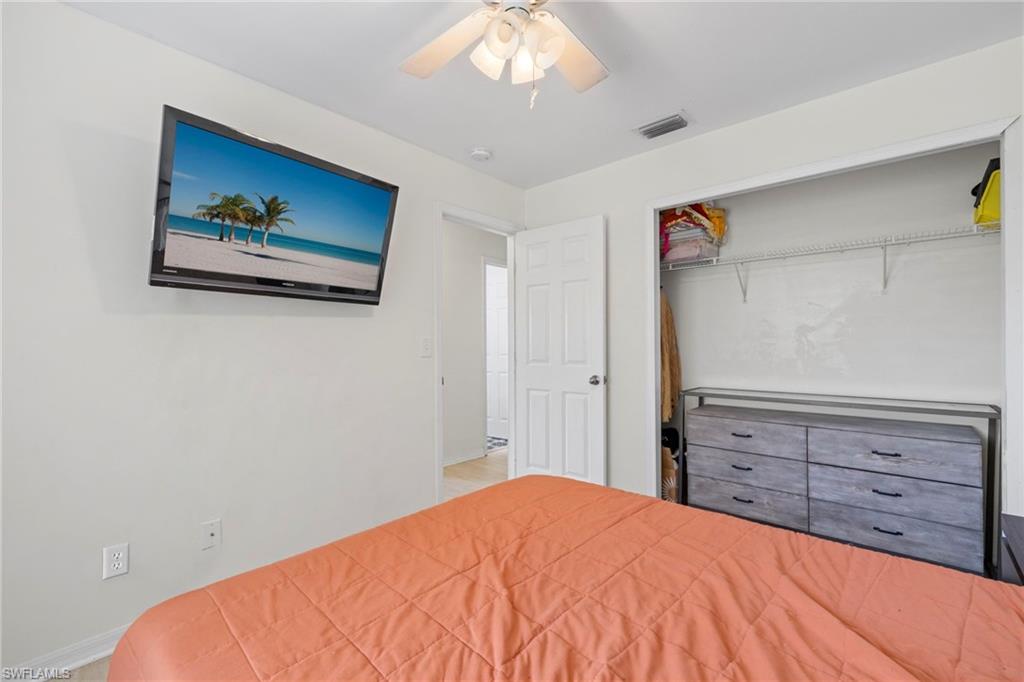 8366 Cardinal Road Fort Myers, FL 33967 - Photo 17 of 25 a bedroom with a bed and a dresser