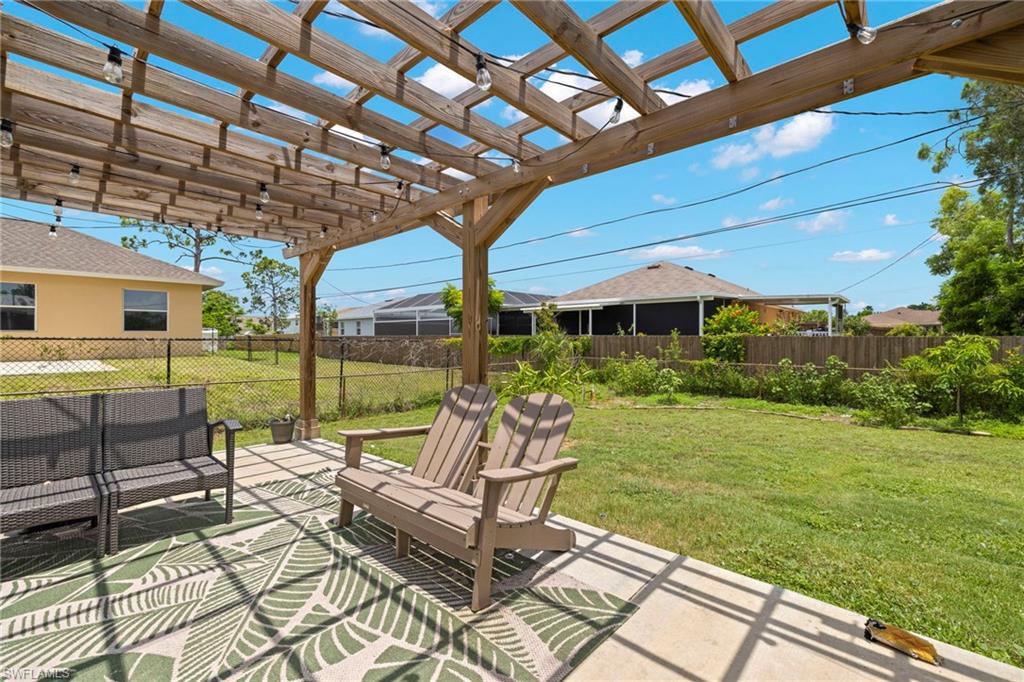 8366 Cardinal Road Fort Myers, FL 33967 - Photo 24 of 25 a patio with glass top table and chairs