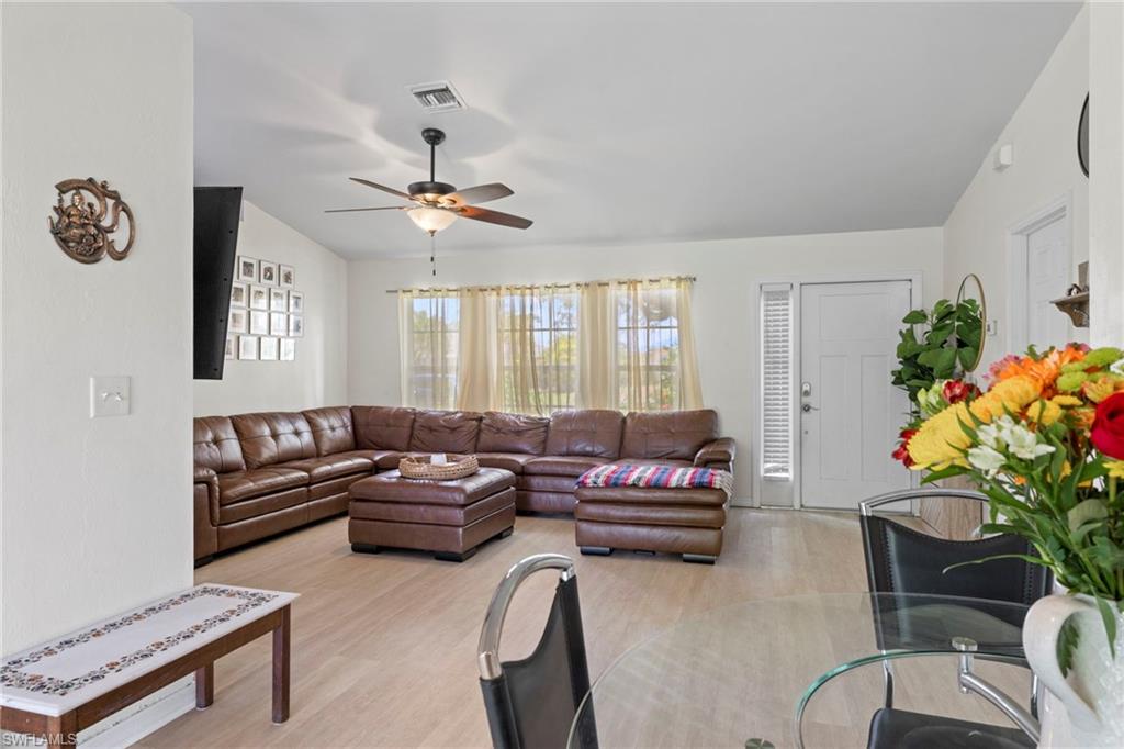 8366 Cardinal Road Fort Myers, FL 33967 - Photo 7 of 25 a living room with furniture plant and a window
