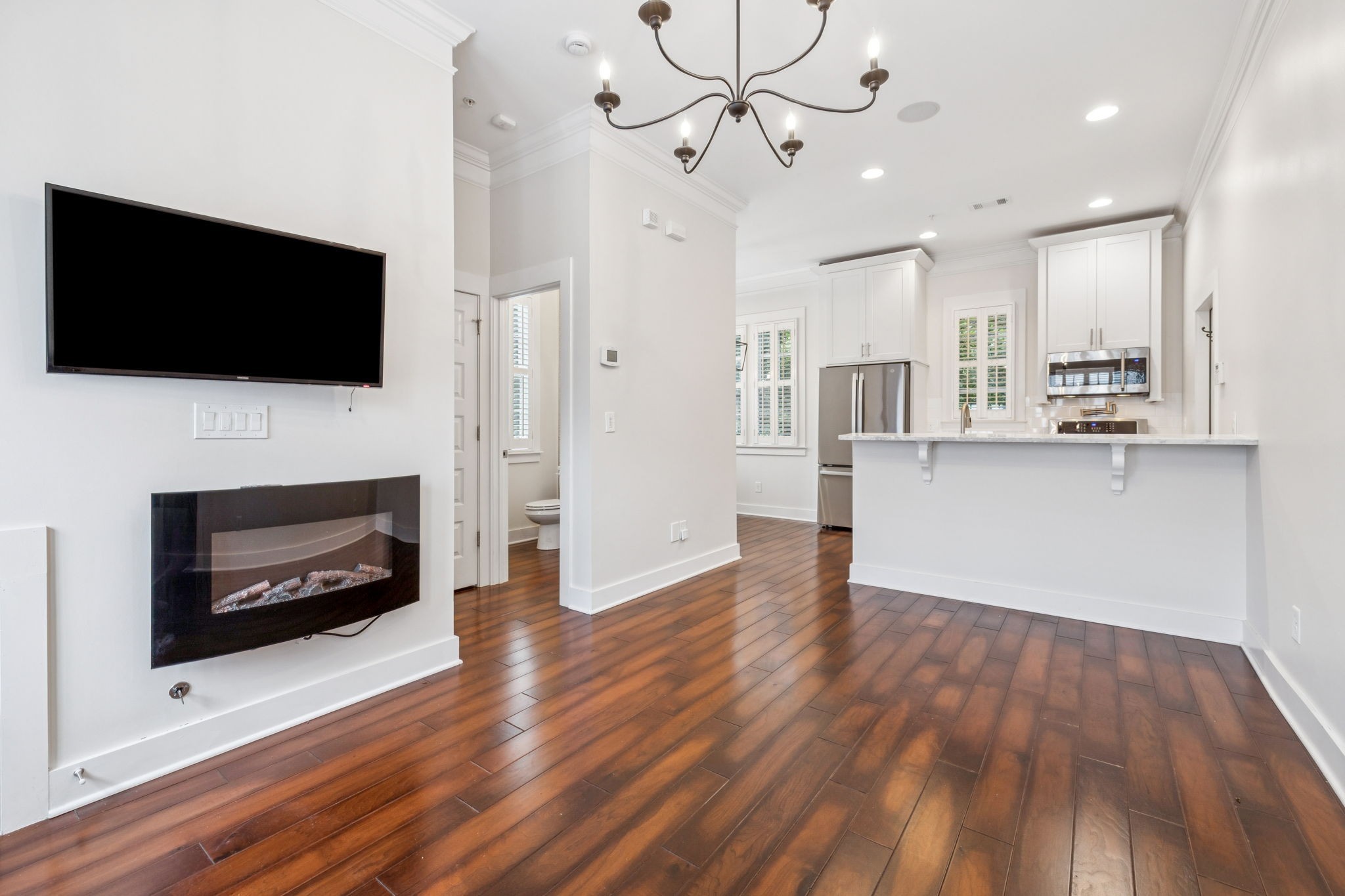 100 Cottage Lane Franklin, TN 37064 - Photo 12 of 64 a view of kitchen living room with furniture and flat screen tv