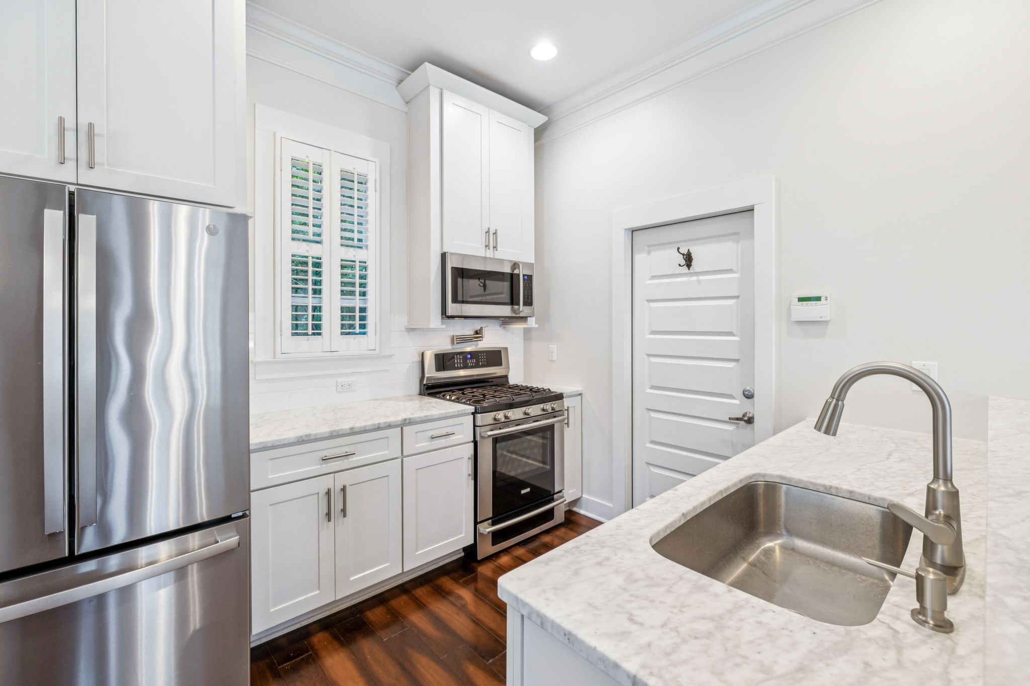 100 Cottage Lane Franklin, TN 37064 - Photo 19 of 64 a kitchen with a sink stove and refrigerator