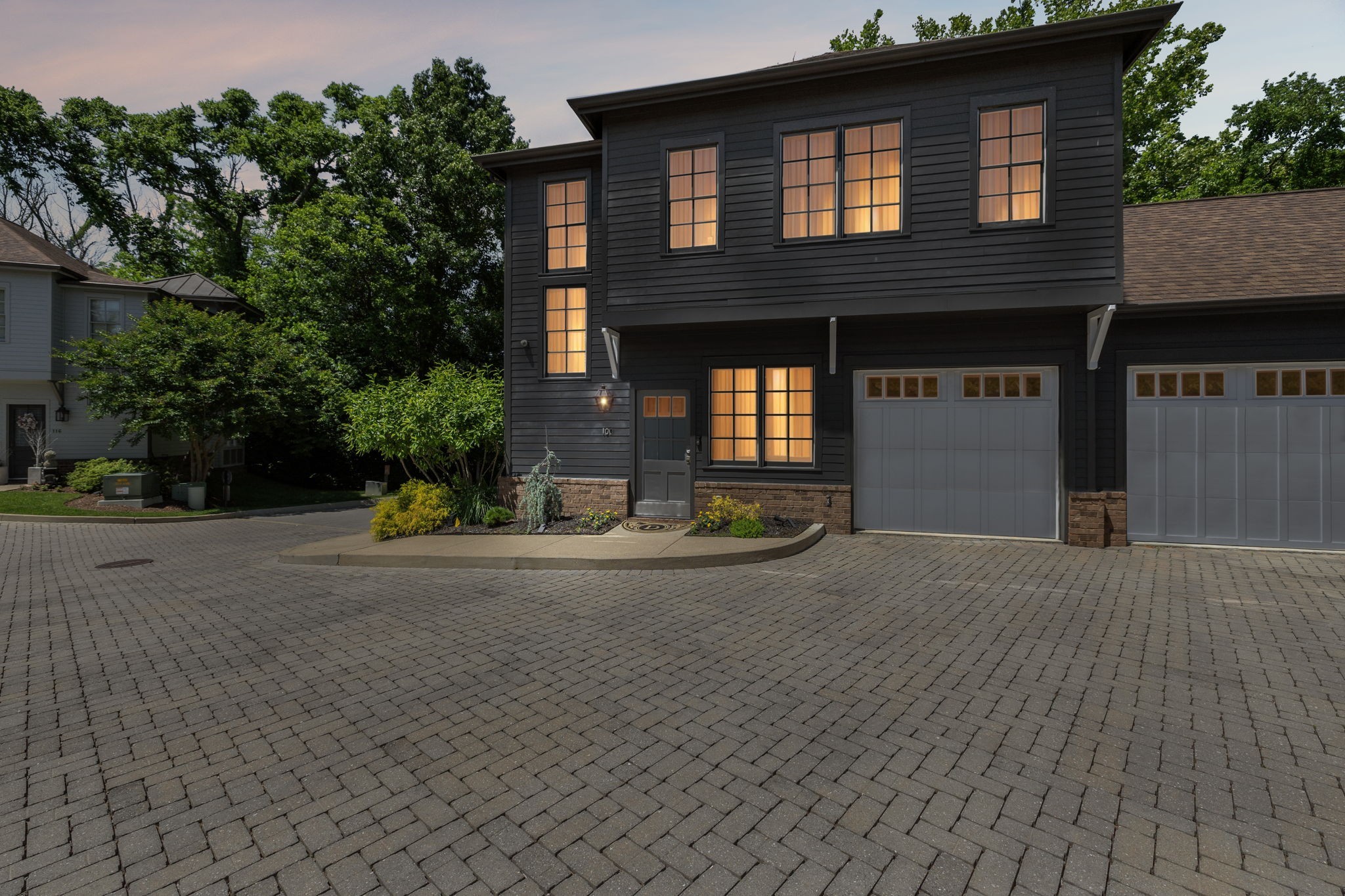 100 Cottage Lane Franklin, TN 37064 - Photo 3 of 64 a front view of a house with a yard and a garage