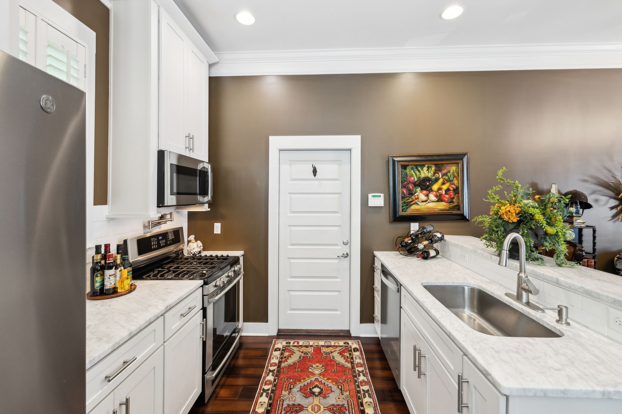 100 Cottage Lane Franklin, TN 37064 - Photo 41 of 64 a kitchen that has a sink and a stove in it